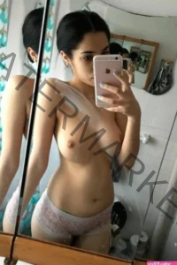 Call girl taking hot mirror selfie